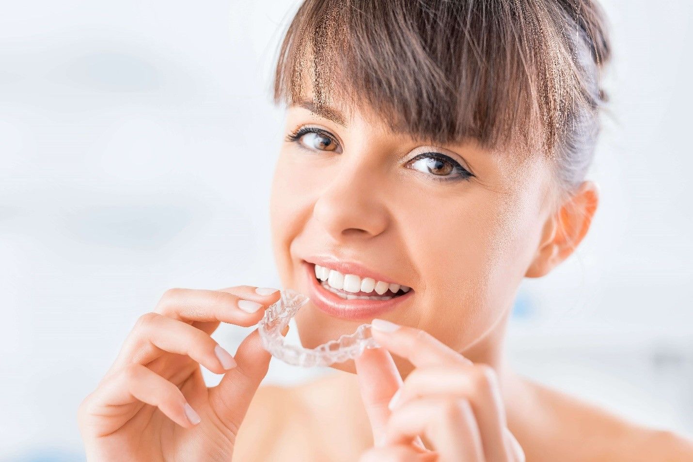 straighten teeth without braces by using clear aligners.jpg